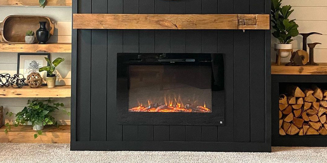 Rustic DIY electric fireplace with reclaimed barn wood mantel, dark shiplap and wood shelves paired with Touchstone Forte Electric Fireplace