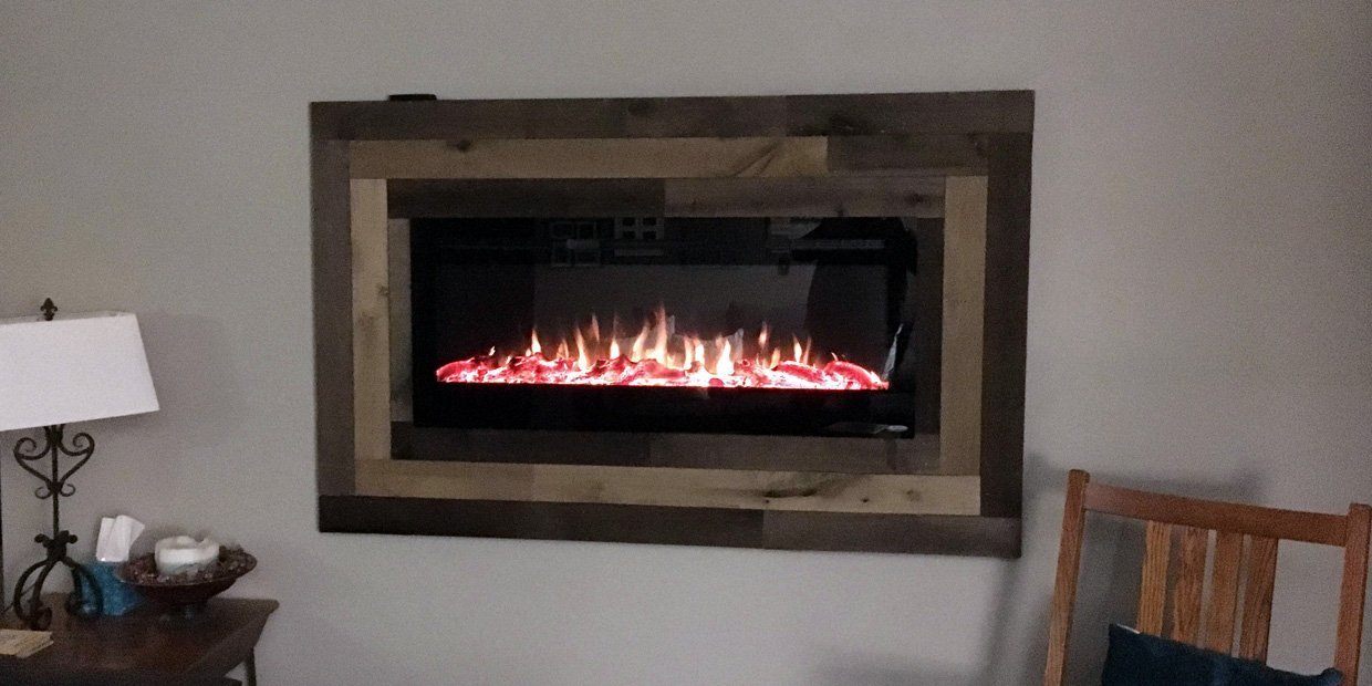 Touchstone Sideline 50 Electric Fireplace framed with wood like artwork