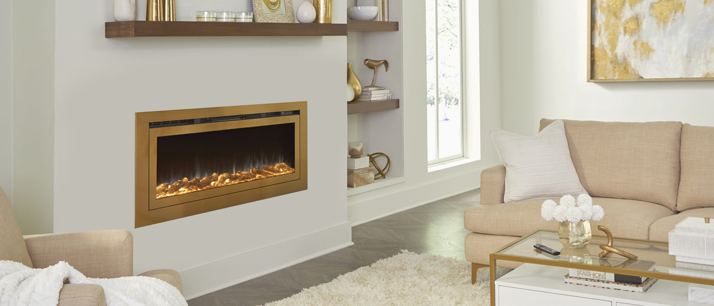 Touchstone Sideline Deluxe Smart Electric Fireplace is inserted into white accent wall with a dark wood mantel.