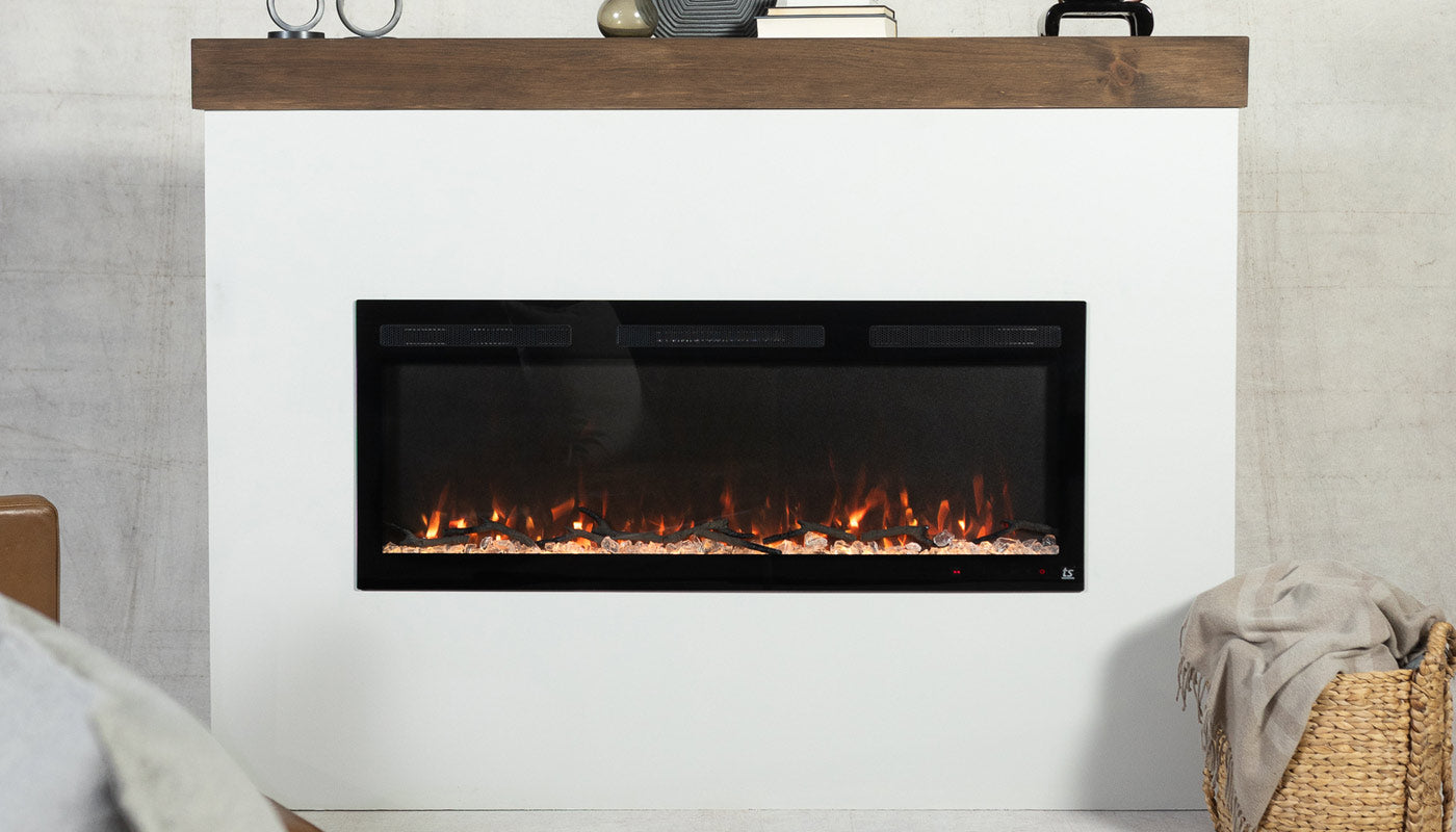 Touchstone Sideline Fury Smart Electric Fireplace inserted in white surround mantel, showing orange flames