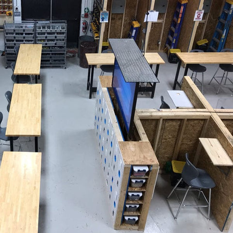 Touchstone SRV TV Lift Cabinet installed in custom built classroom TV lift cabinet by students