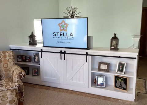 Touchstone Whisper Lift II TV Lift Mechanism in cabinet with barn doors