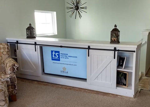 Whisper Lift II TV Lift inside barn door cabinet in down position