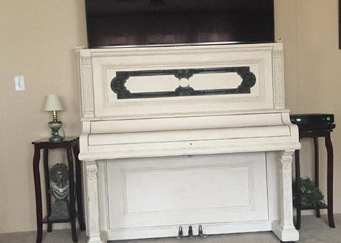 Whisper Lift II TV Lift Mechanism in an upcycled piano stows a large flat screen TV.