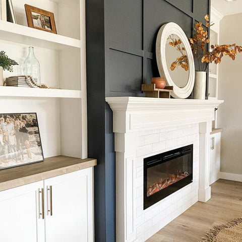 Touchstone Sideline Electric Fireplace with dark gray paneled wall by @theblairhouseproject