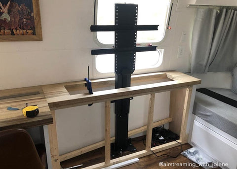 Touchstone Whisper Lift PRO TV Lift in a custom cabinet frame in an Airstream RV