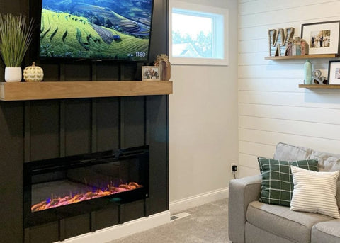 Sideline Electric Fireplace with dark gray wall and light wood mantel