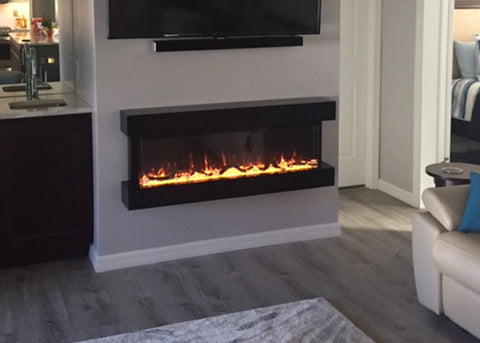 Touchstone Chesmont Wall Hanging Electric Fireplace with mantel in the living room