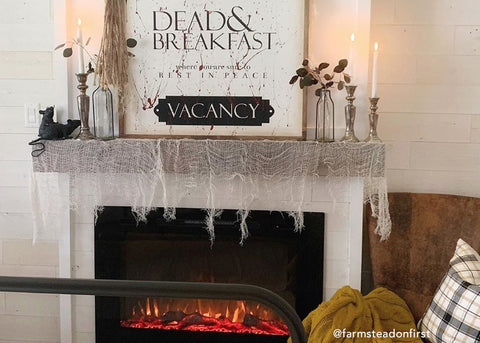 Halloween spirit with the Forte Electric Fireplace, designed by @farmsteadonfirst