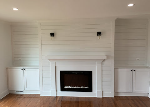 Touchstone Forte Electric Fireplace with shiplap wall and built in cabinets