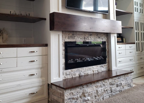 Sideline Electric Fireplace in stone and dark wood fireplace mantel with built in shelves by customer Brittany