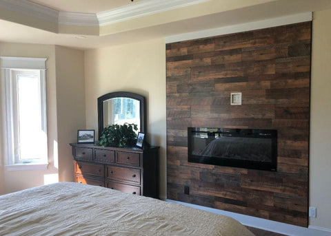 Touchstone Sideline Electric Fireplace with wood paneling surround by Renaissance Builders, DE
