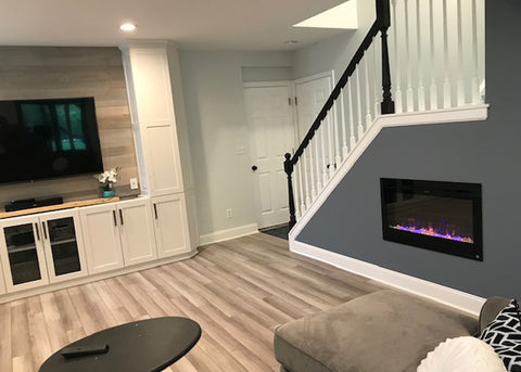 Touchstone Sideline 36 Electric Fireplace installed in a staircase design