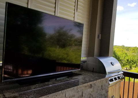 Touchstone Whisper Lift Pro TV Lift in outside grill area