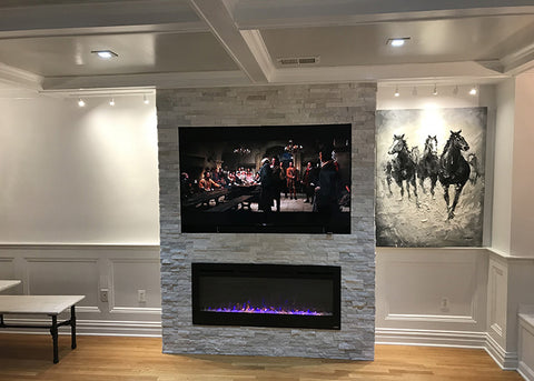 Sideline 50 Electric Fireplace in a ceiling to floor stone mantel