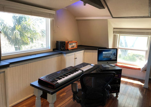 Touchstone Whisper Lift TV Lift mechanism hidden in a cabinet for an unobstructed window view.