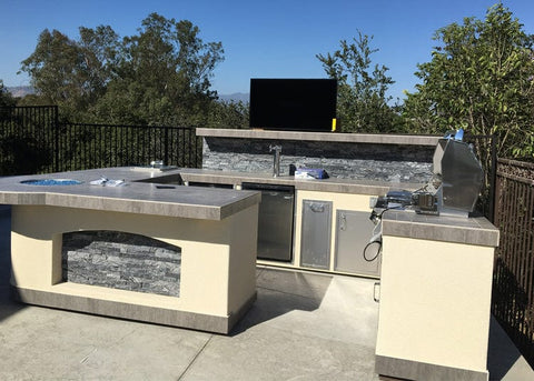 Whisper Lift TV lift mechanism in outdoor patio area for outside viewing
