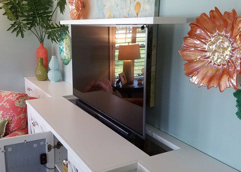 The Touchstone Whisper Lift TV lift mechanism with the flat top lift mount in a custom built cabinet