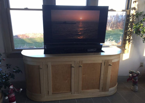 Whisper Lift TV Lift in a custom curved TV lift cabinet