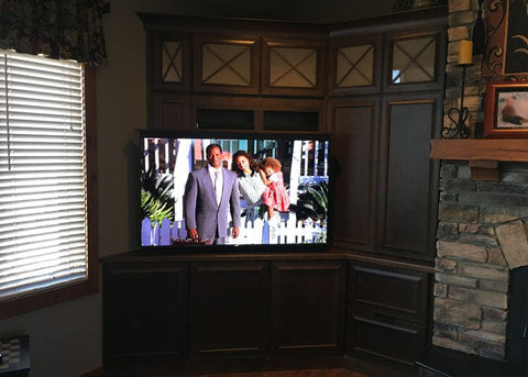 Whisper Lift II TV Lift Mechanism This custom TV lift cabinet is the cornerstone of the room