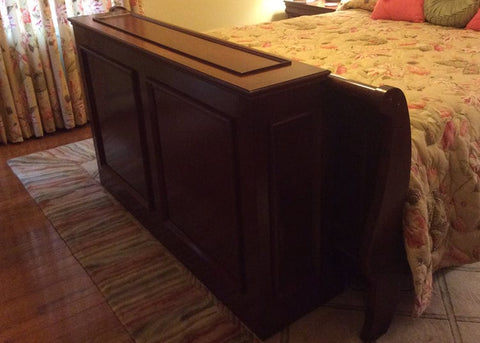 Whisper Lift TV Lift in a custom built end of bed TV lift cabinet