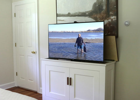 Custom built cabinet by Jon Peters Art & Home with Touchstone Whisper Lift TV Lift