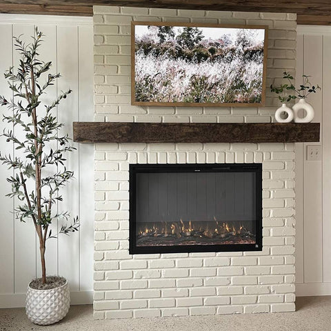 Touchstone Forte Elite Smart Electric Fireplace in a white brick fireplace accent wall by @strippedandstyled