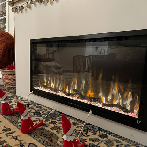 Touchstone Sideline Elite 50 Electric Fireplace decorated for Christmas with elves roasting marshmallows