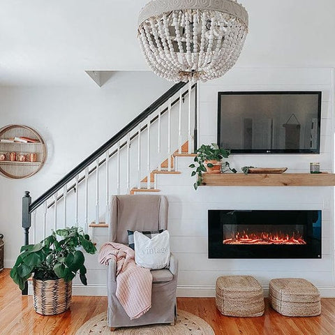 Touchstone Onyx Electric Fireplace hung on the staircase wall