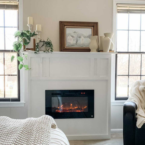 Touchstone Sideline 28 Electric Fireplace in white mantel insert in bedroom by @instagrahamhome