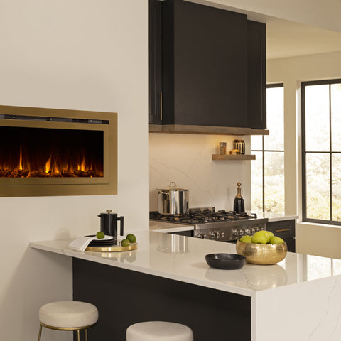 Touchstone Sideline Deluxe Gold Smart Electric Fireplace in a gold accent kitchen with dark gray cabinets