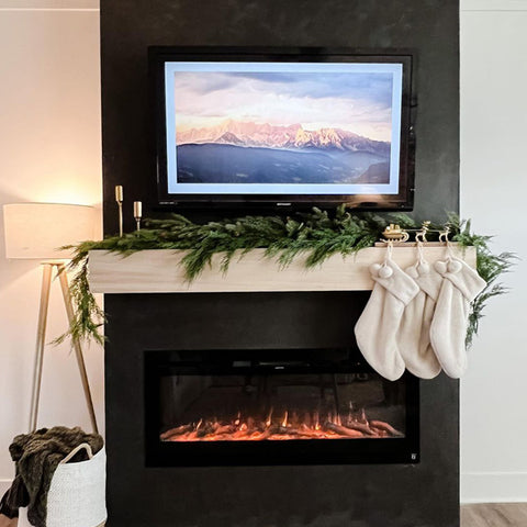 Touchstone Sideline Electric Fireplace in black accent wall by @oliveandoakhome