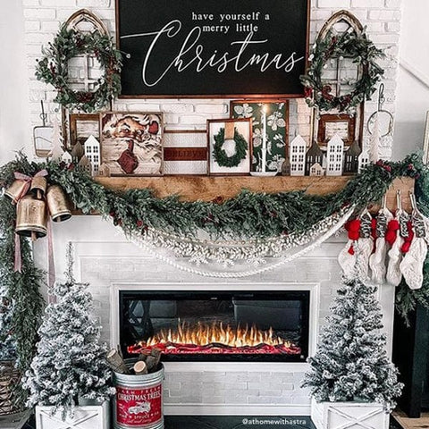Touchstone Sideline Elite Smart Electric Fireplace decorated for Christmas, photo credit @athomewithastra