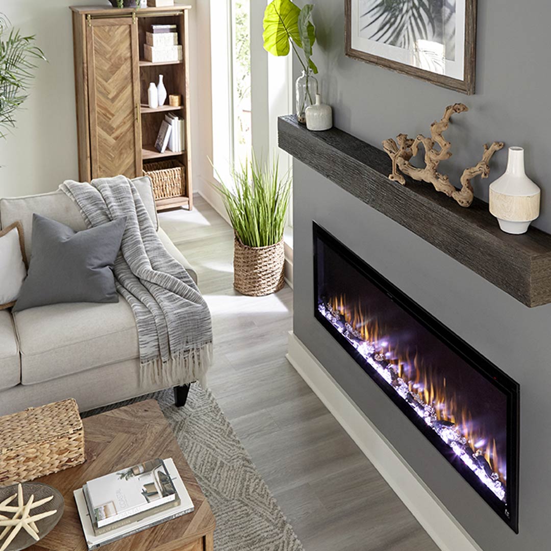 Touchstone Sideline Elite Smart Electric Fireplace inserted in a dark gray wall with dark wood mantel