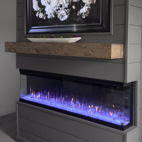 Touchstone Sideline Infinity 60 Smart Electric Fireplace in dark gray shiplap wall in bedroom by Francesca Jeanette