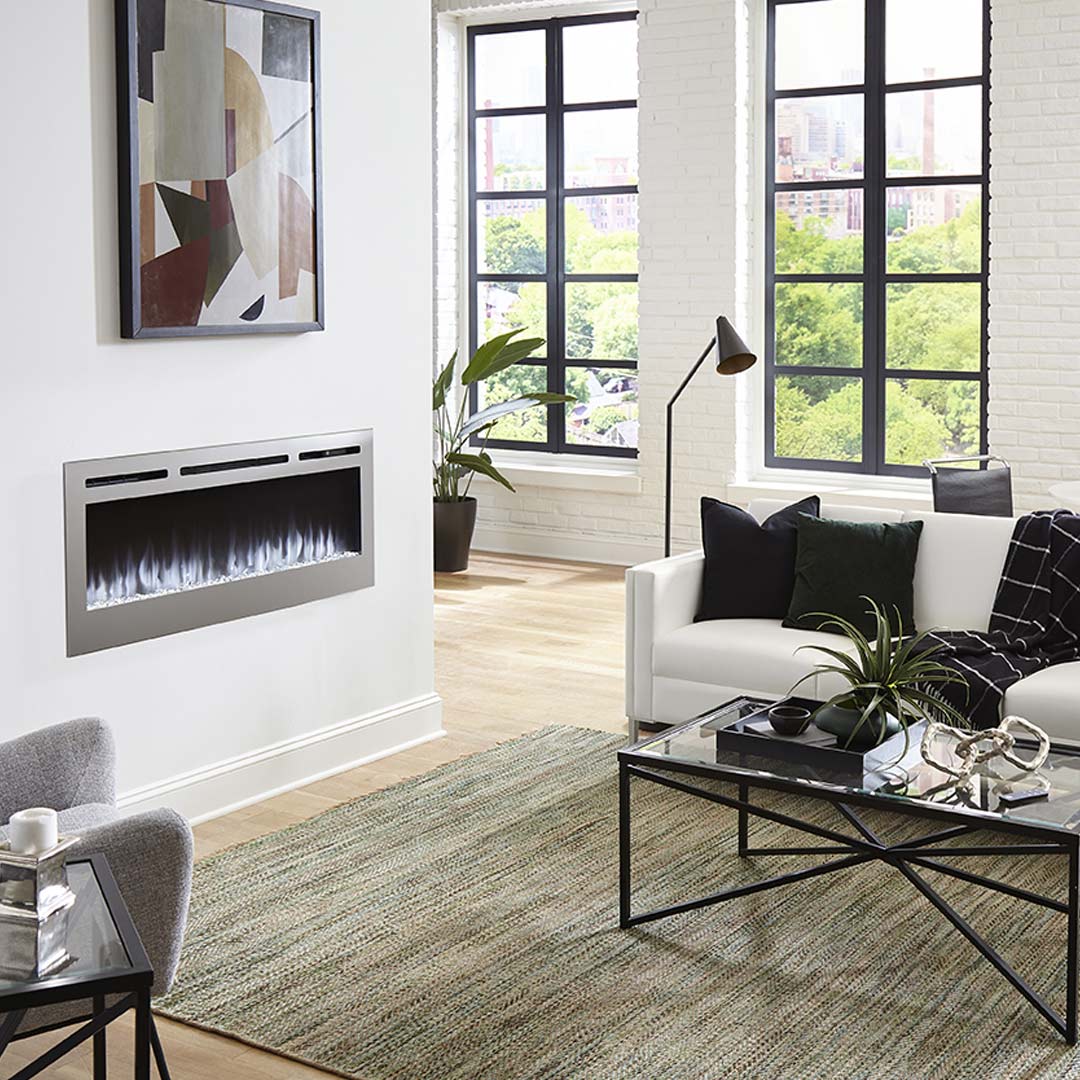 Touchstone Sideline Stainless Deluxe Electric Fireplace in a black and white neutral styled room