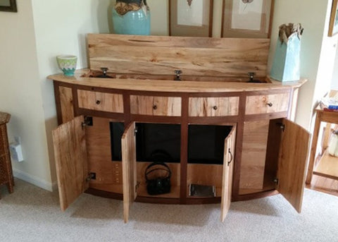 Touchstone Whisper Lift TV in a custom TV lift cabinet with doors