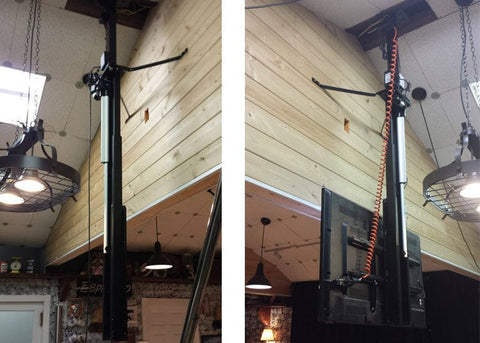 Whisper Lift TV Lift lowers a large screen TV from the ceiling