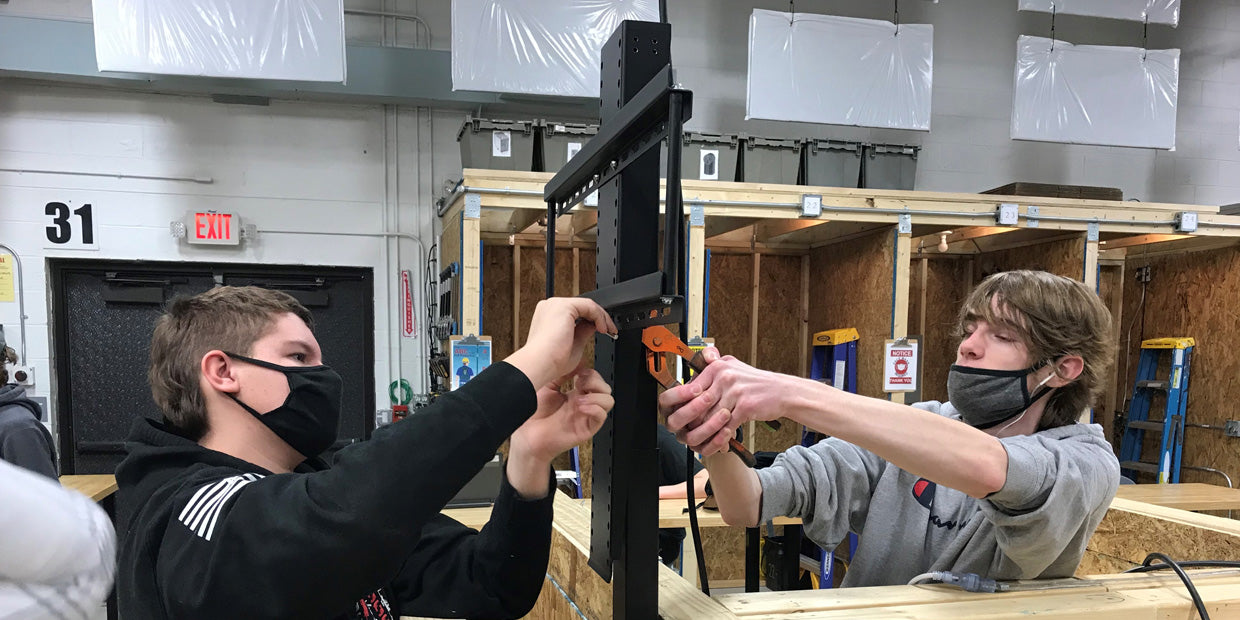 Students at the BOCES2 technical high school install a Touchstone SRV TV Lift