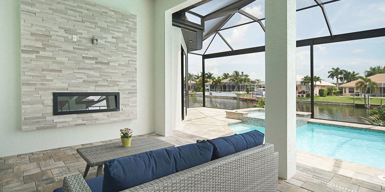 Touchstone Sideline Outdoor Electric Fireplace in covered patio pool area by Premier Cape Construction