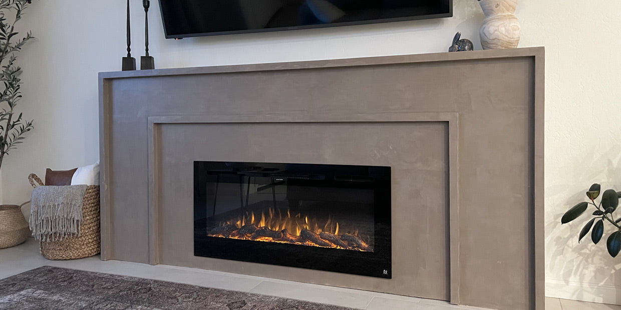 Best friends build a Roman clay fireplace accent wall featuring Touchstone Sideline 45 Electric Fireplace