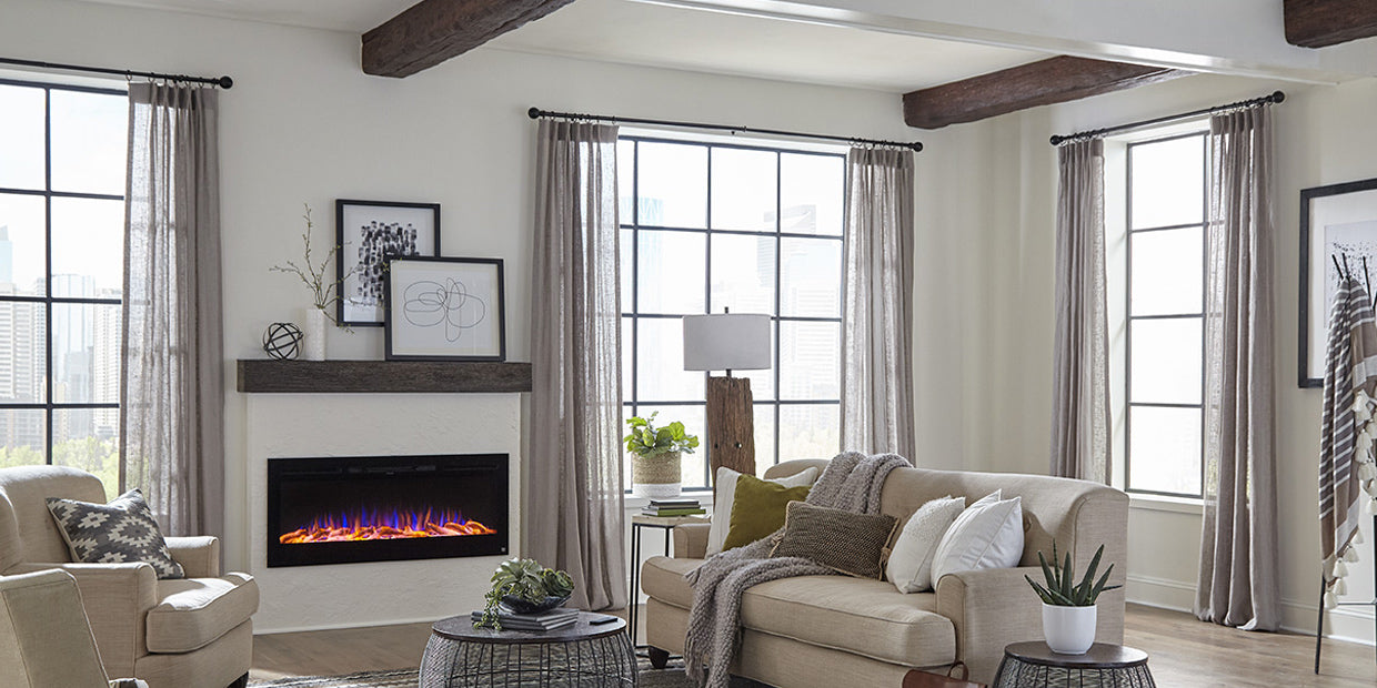 Touchstone Sideline 50 Electric Fireplace in a great room with white bump out wall and ebony wood mantel