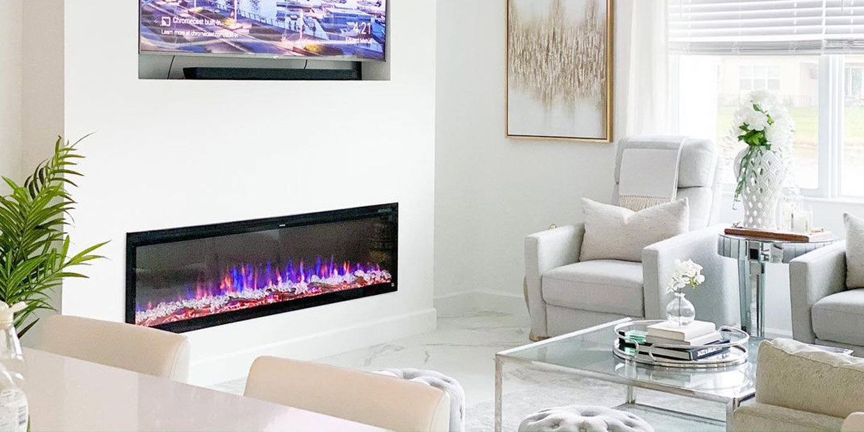 Touchstone Sideline Elite 72 Electric Fireplace recessed into white bump out wall in glam luxe style living room by @livelovelucceus