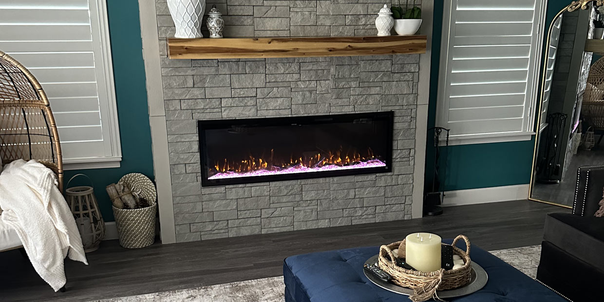 Touchstone Sideline Elite Smart Electric Fireplace in faux stacked stone wall