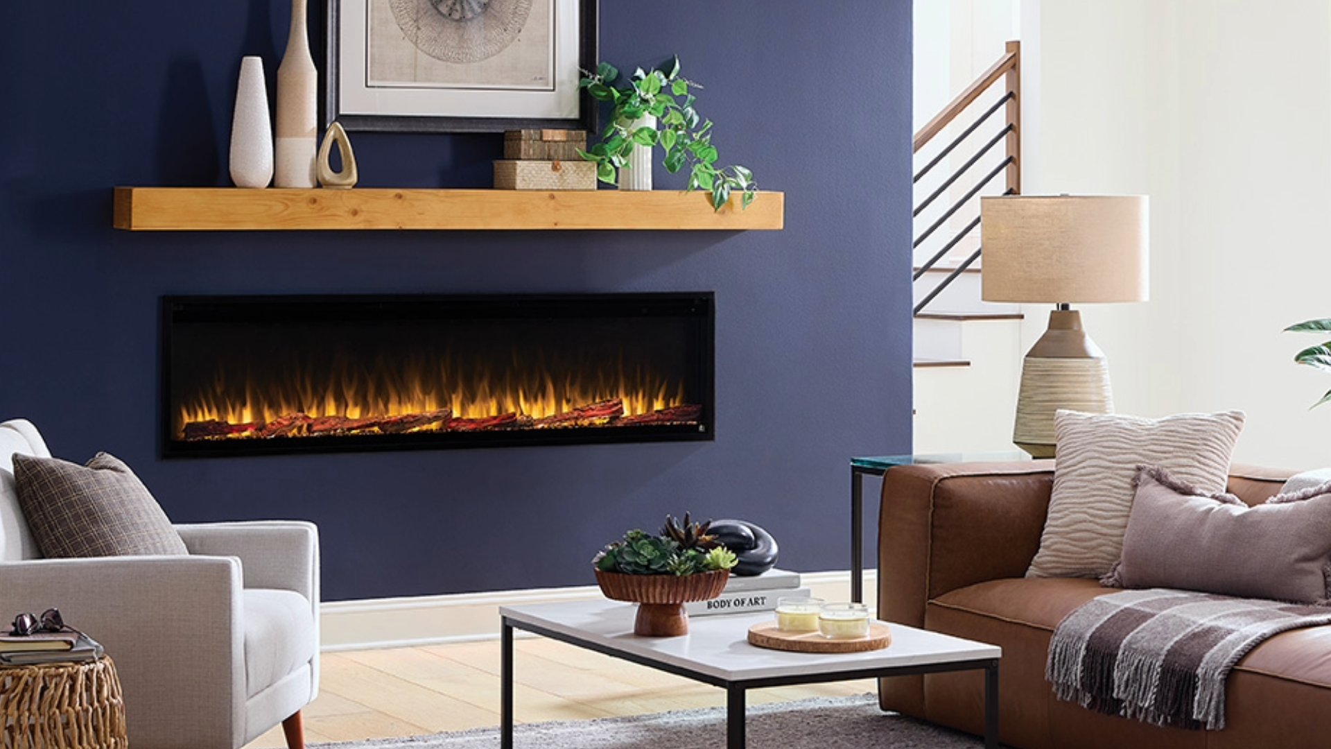 Closeup of Touchstone Encase® Floating Shelf Mantel in Natural Finish mounted above a Touchstone Sideline® Elite Pro 72 Smart Electric Fireplace in blue wall