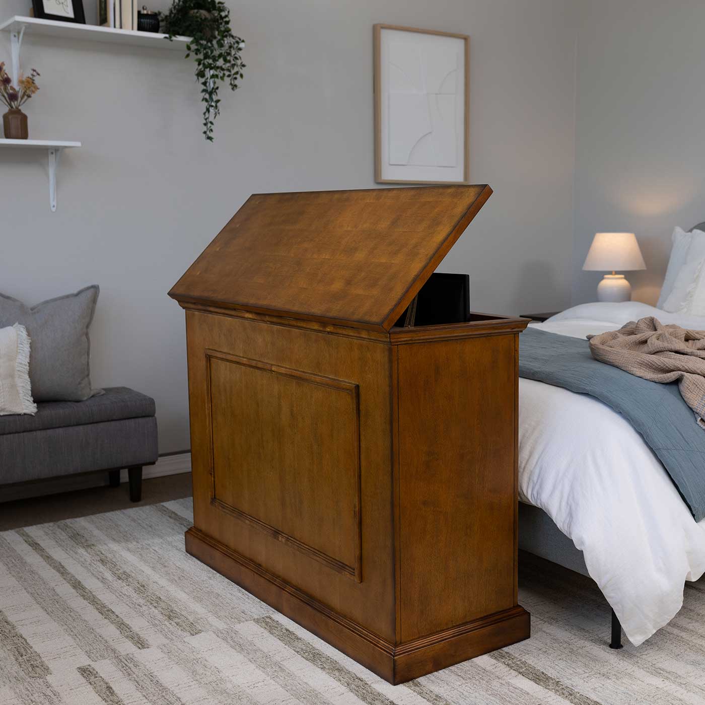 Touchstone Elevate 72009 TV Lift raises the hidden TV into view in the bedroom.