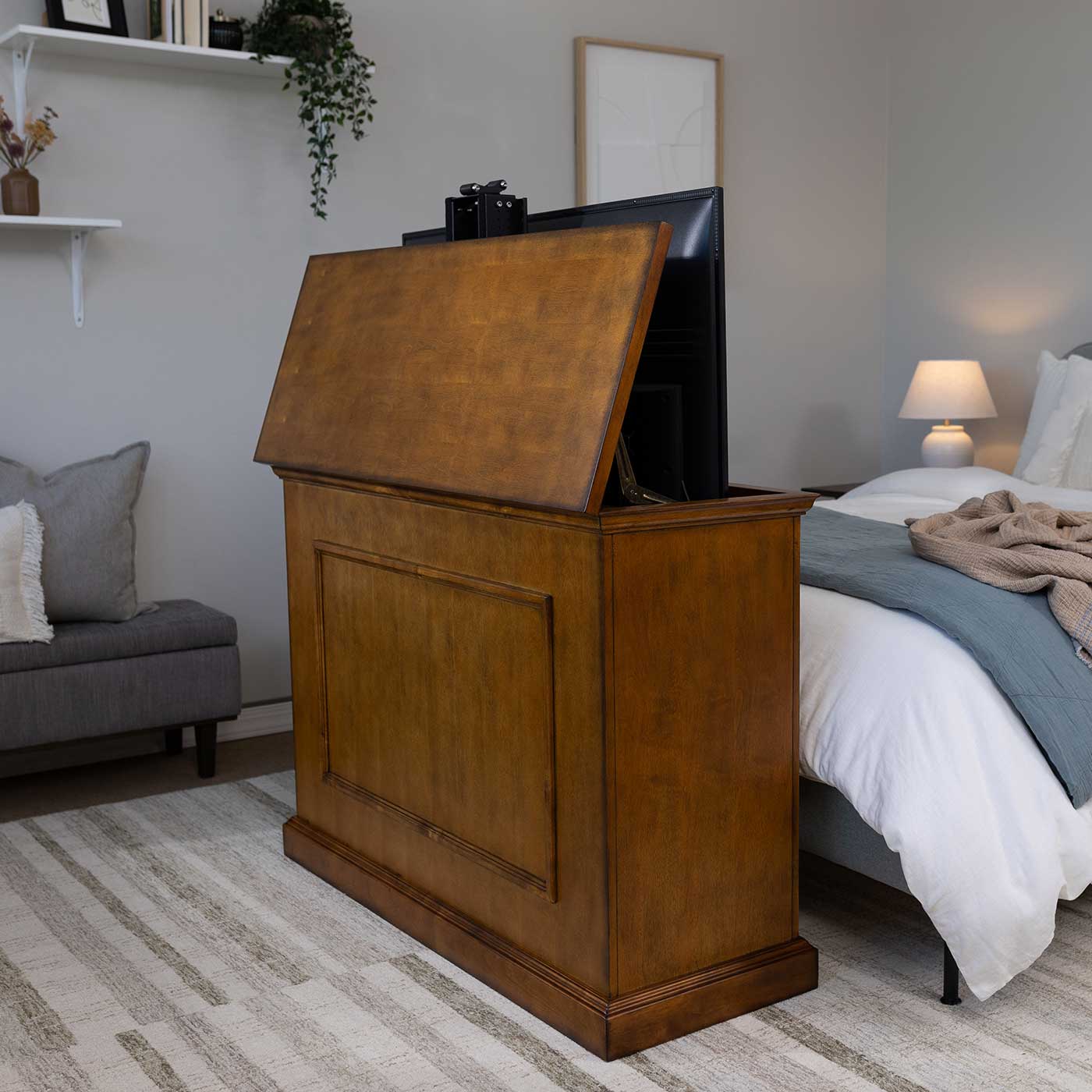 Touchstone Elevate 72009 TV Lift raises the hidden TV into view in the bedroom.