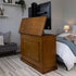 Touchstone Elevate 72009 TV Lift pictured in a bedroom with the cabinet opened fully.