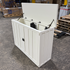 Touchstone 72013 White Elevate Mission Smart TV Lift Cabinet open box unit photographed in the warehouse.