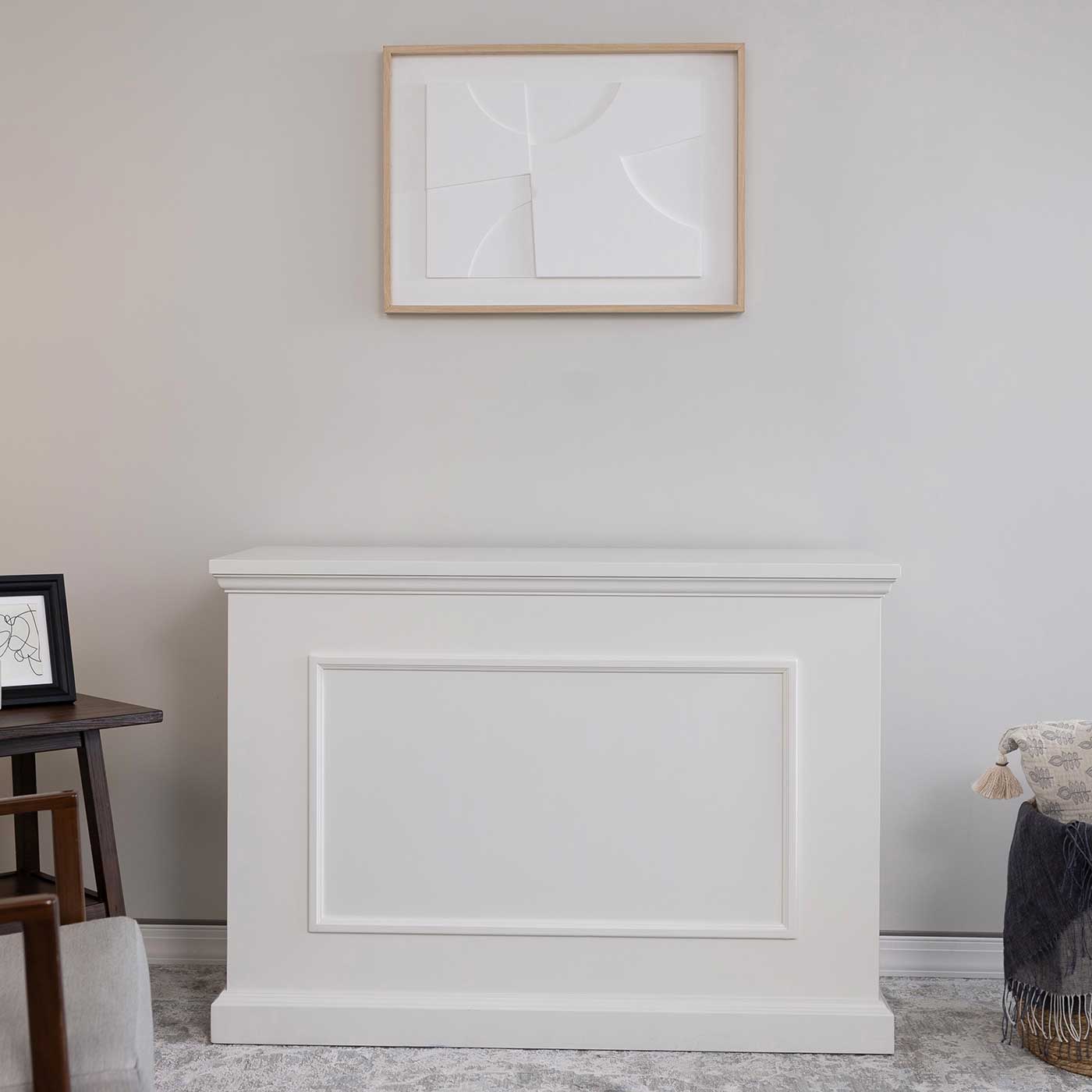 Touchstone Elevate 72015 TV Lift Cabinet in White wood finish pictured in a living room from the front. 